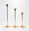 Candelabros Solenne de metal dorado, set de 3