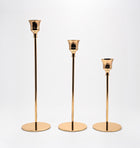 Candelabros Solenne de metal dorado, set de 3